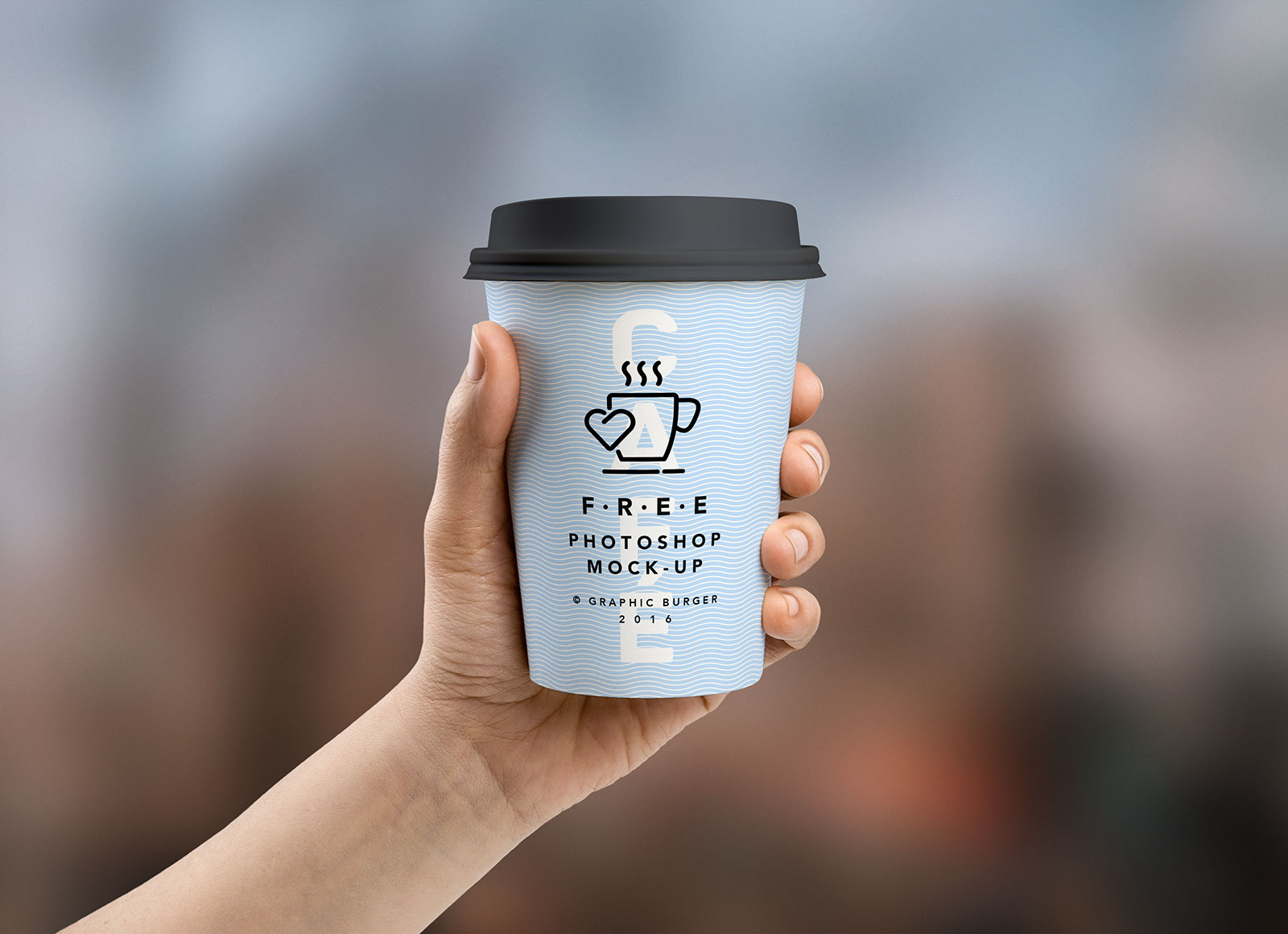 Free Coffee Paper Cup in Hand Mockup PSD - Good Mockups