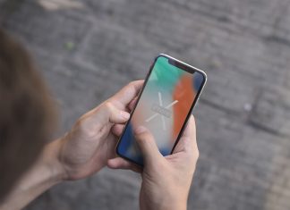 Free-iPhone-X-in-Hand-Photo-Mockup-PSD