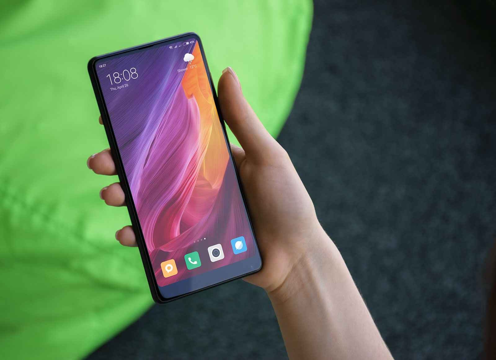 Free-Xiaomi-Mi-Mix-2-Mobile-Phone-in-Female-Hand-Mockup-PSD