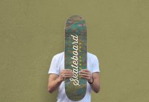 Free-Man-Holding-Skateboard-Mockup-PSD