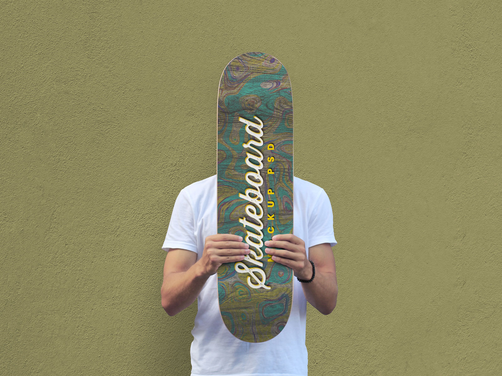 Free-Man-Holding-Skateboard-Mockup-PSD