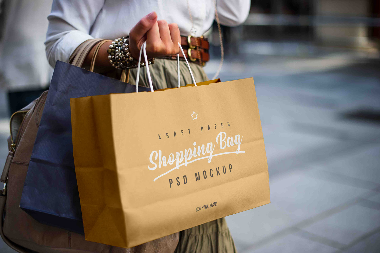 Free-Female-Holding-Kraft-Paper-Shopping-Bag-Mockup-PSD
