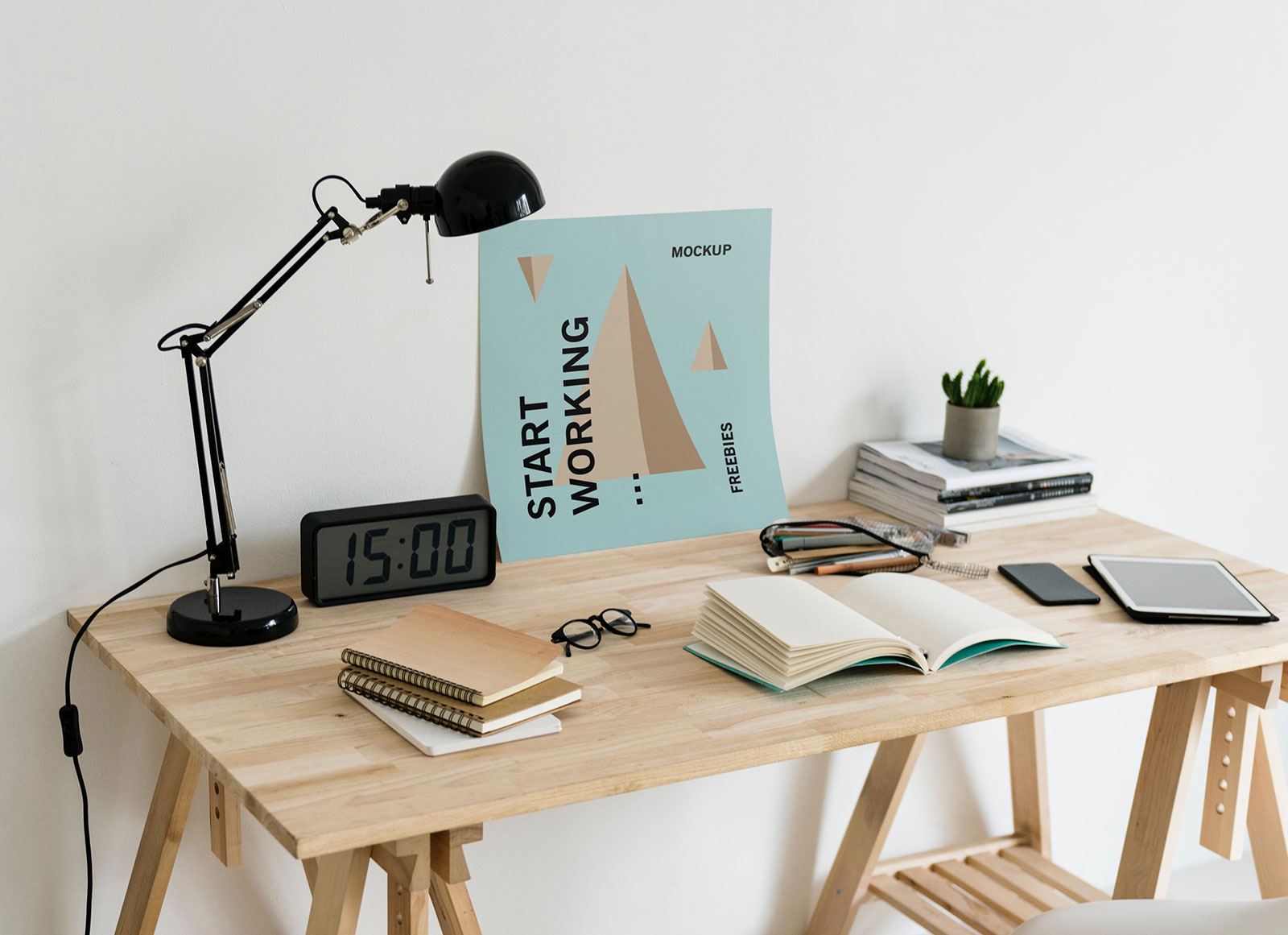 Free-Poster-on-Workplace-Mockup-PSD