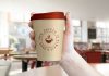 Free-Hand-Holding-Coffee-Cup-Mockup-PSD-File
