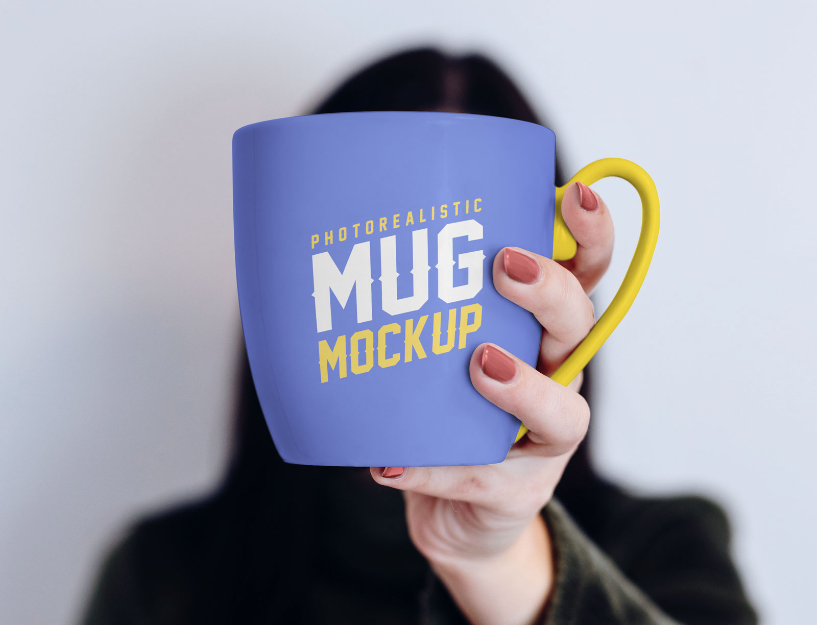 Free-Mug-in-Female-Hand-Mockup-PSD-2