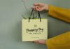 Free-Hand-Holding-Shopping-Bag-Mockup-PSD