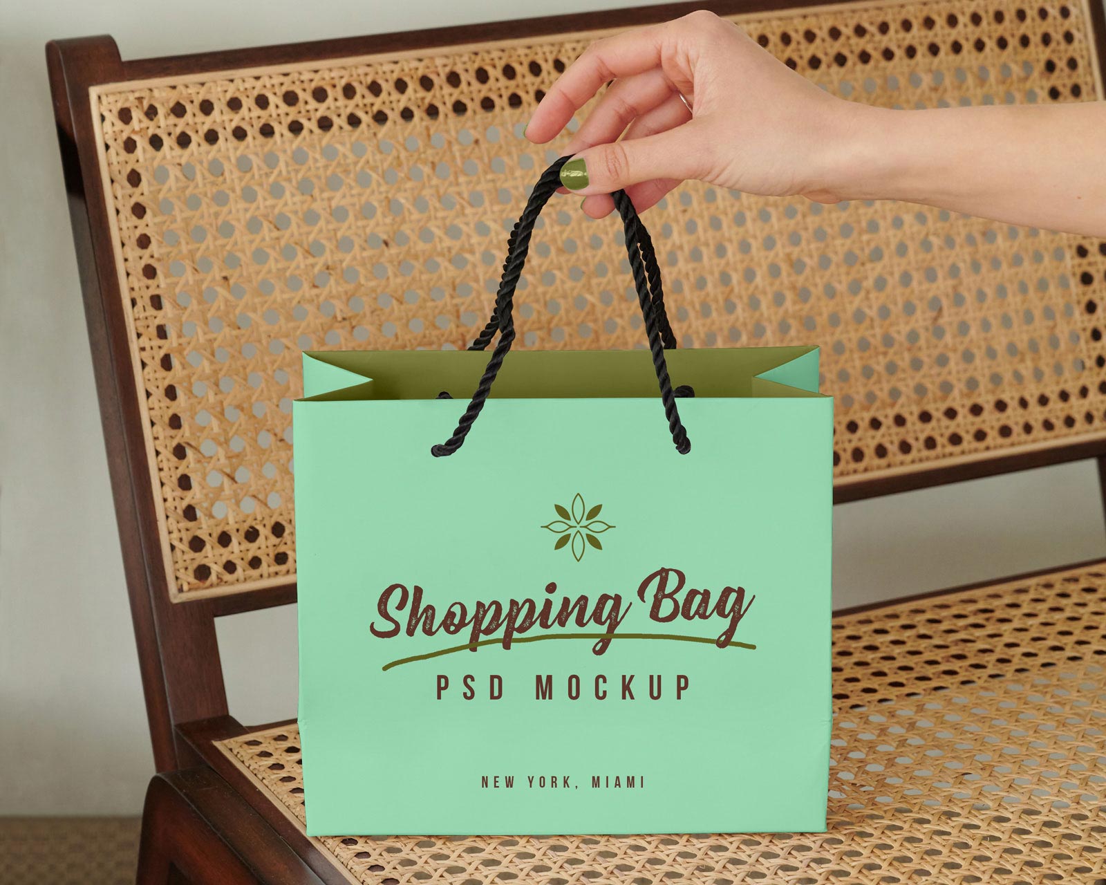 Free-Hand-Holding-Shopping-Bag-Mockup-PSD-file