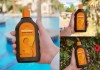 Free Hand Holding Sunscreen Bottle Mockup PSD Set