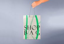 Free-Hand-Holding-Paper-Shopping-Bag-Mockup-PSD