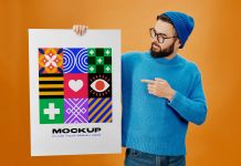 Free-Large-Hand-Holding-Poster-Mockup-PSD-File