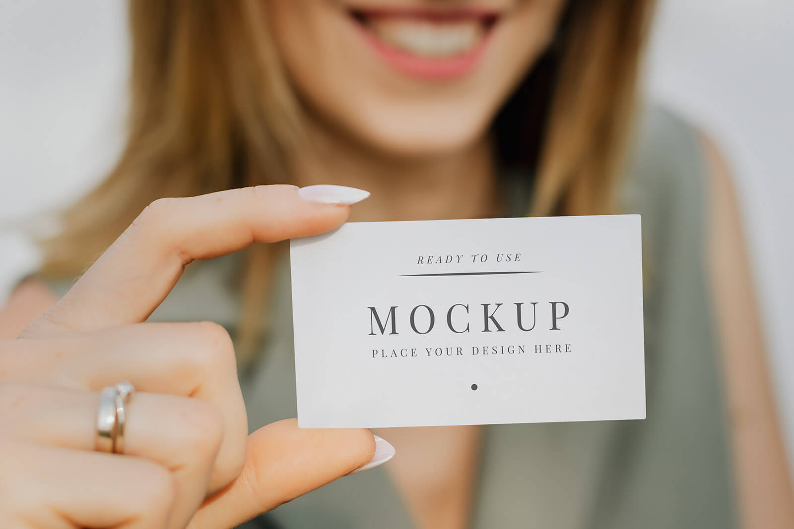 Free-Female-Hand-Holding-Business-Card-Mockup-PSD
