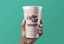 Free Hand Holding Paper Coffee Cup Mockup PSD