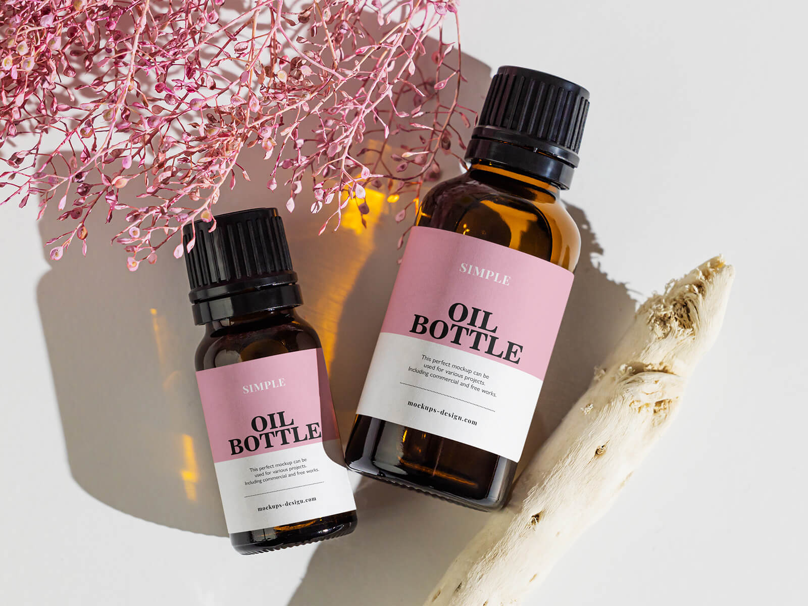 Free Small Amber Essential Oil Bottles Mockup PSD