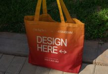 Free Realistic Girl Holding Tote Shopping Bag Mockup PSD