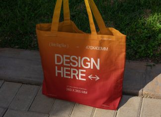 Free Realistic Girl Holding Tote Shopping Bag Mockup PSD