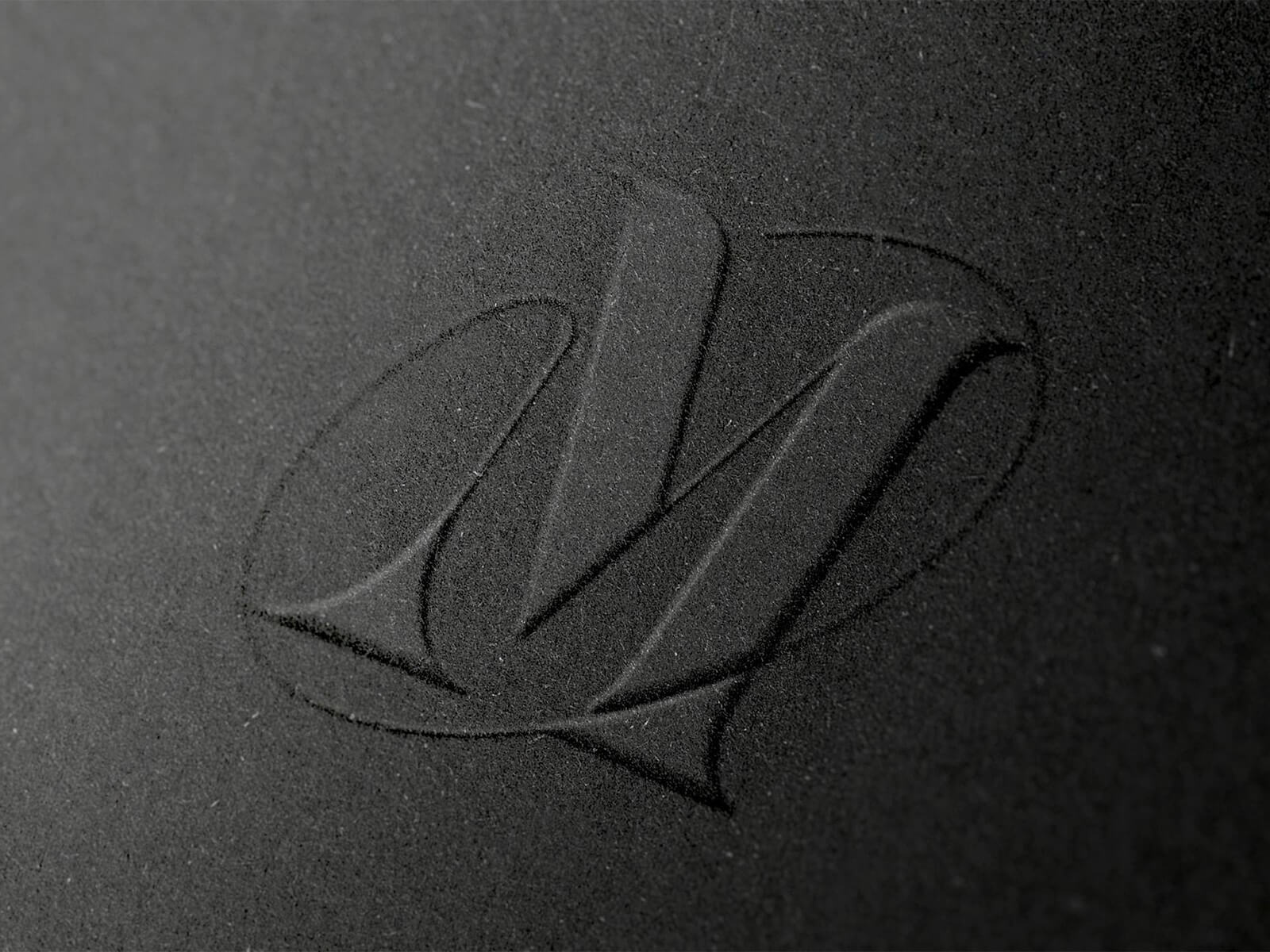 Free-Close-Up-Embossed-Paper-Logo-Mockup-PSD