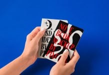 Free-Hand-Holding-Paper-Notebook-Mockup-PSD
