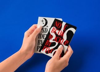 Free-Hand-Holding-Paper-Notebook-Mockup-PSD