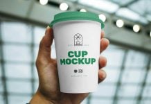 Free Hand Holding Coffee Cup Mockup PSD