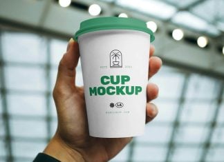 Free Hand Holding Coffee Cup Mockup PSD