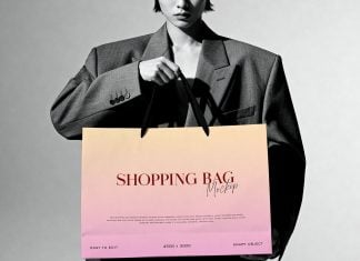 Free B&W Model Holding Shopping Bag Mockup PSD