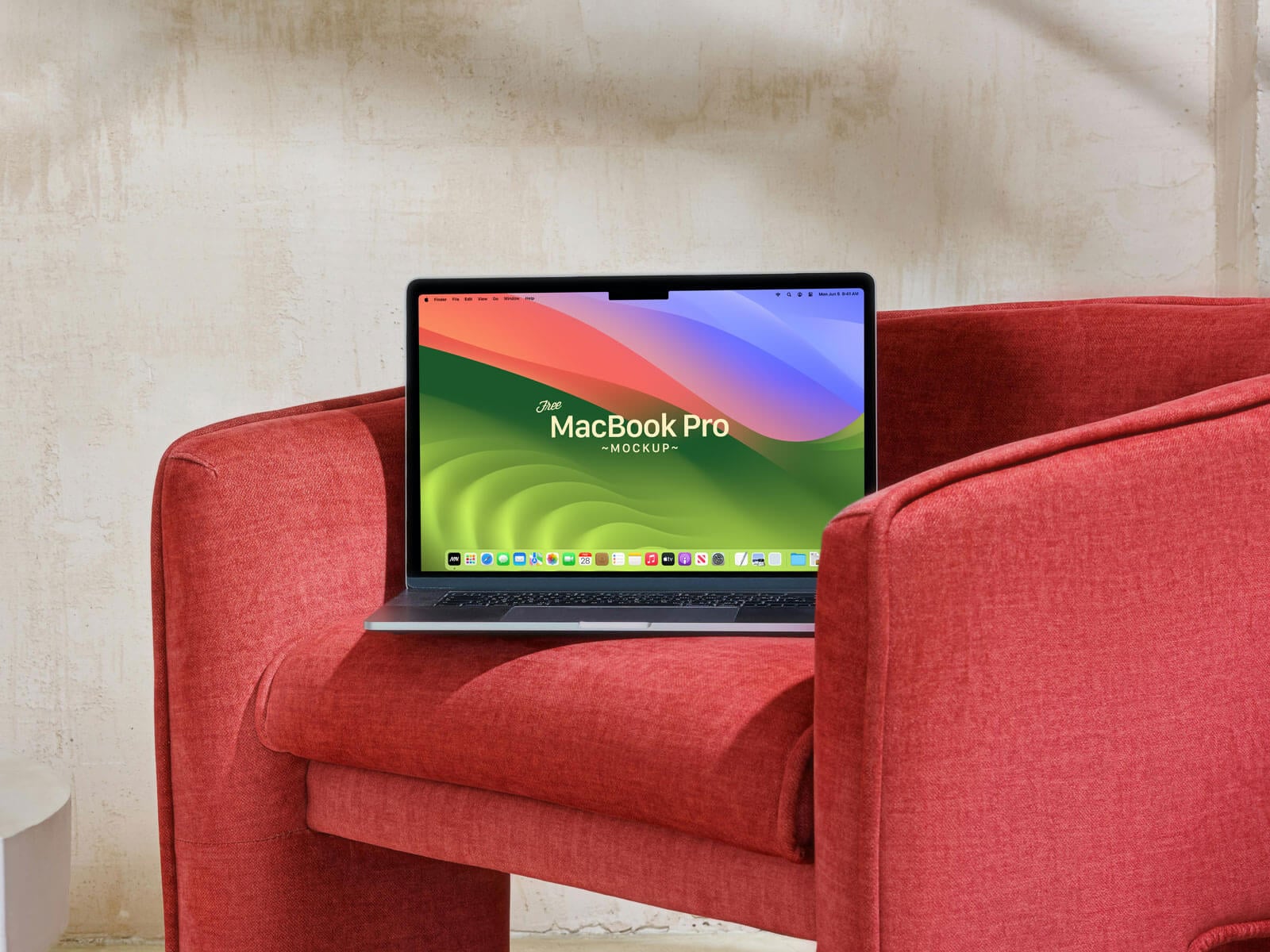 Free-MacBook-Pro-On-Sofa-Mockup-PSD