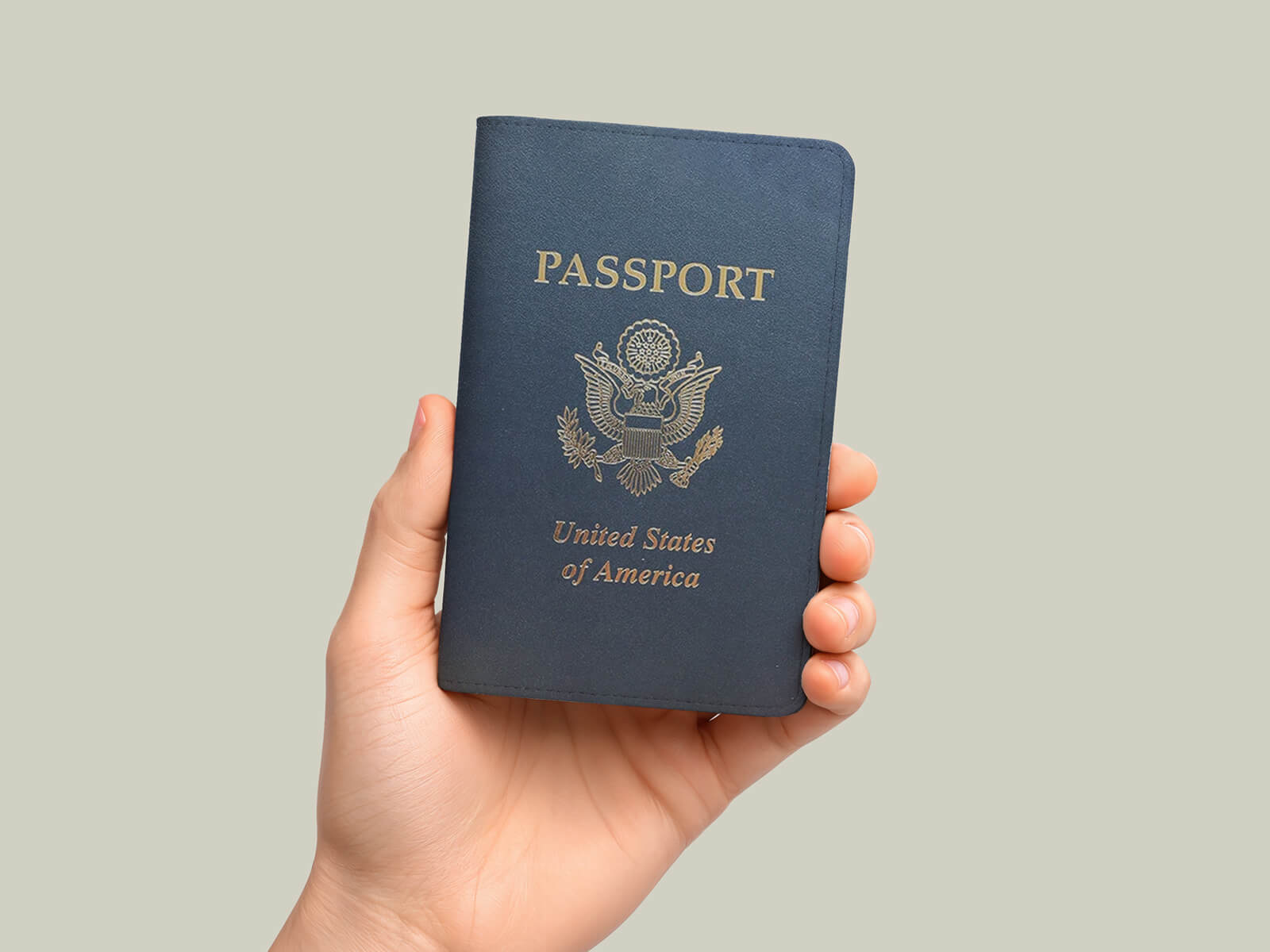Free Hand-Held Passport Booklet Cover Mockup PSD