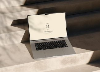 Free Shadow 16″ MacBook Pro Mockup PSD