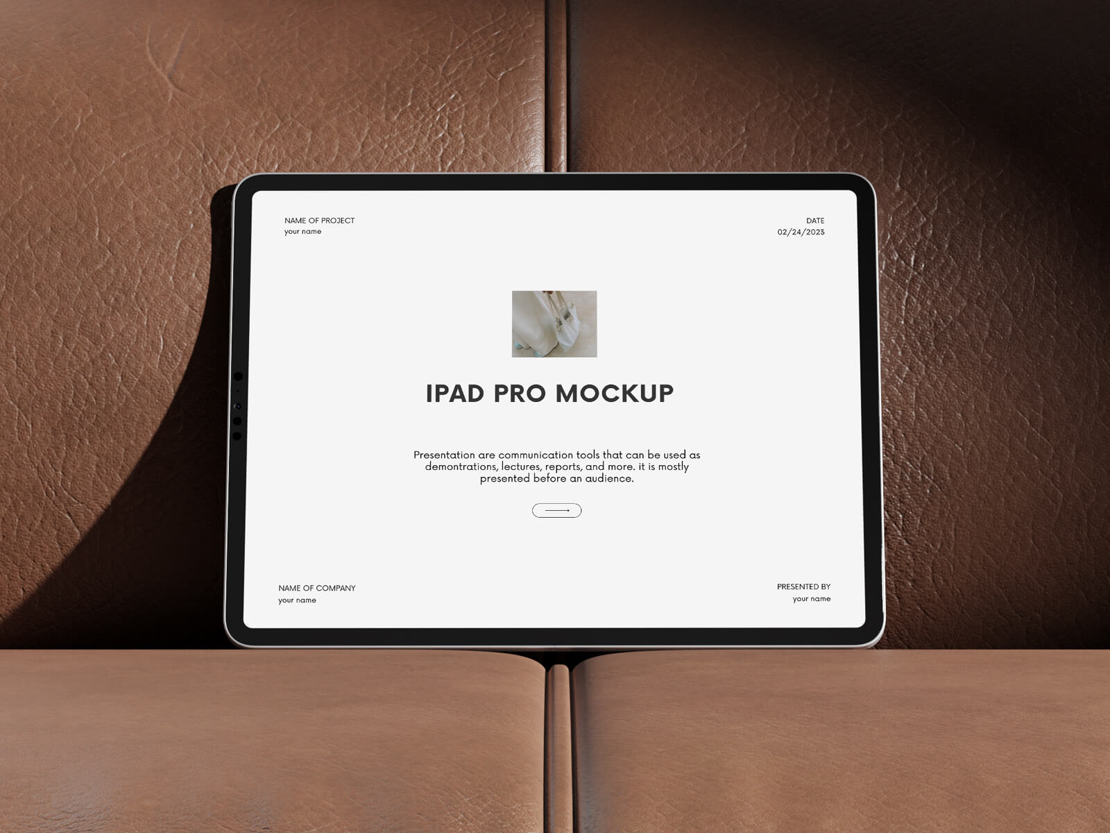 Free iPad Pro On Leather Couch Mockup PSD