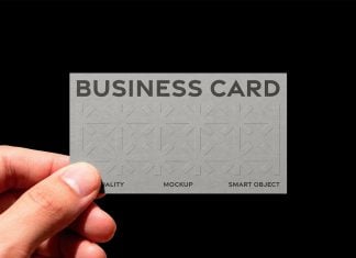 Free Embossed Textured Hand-Holding Business Card Mockup PSD