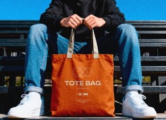 Free Hand-Holding Canvas Tote Bag Mockup PSD