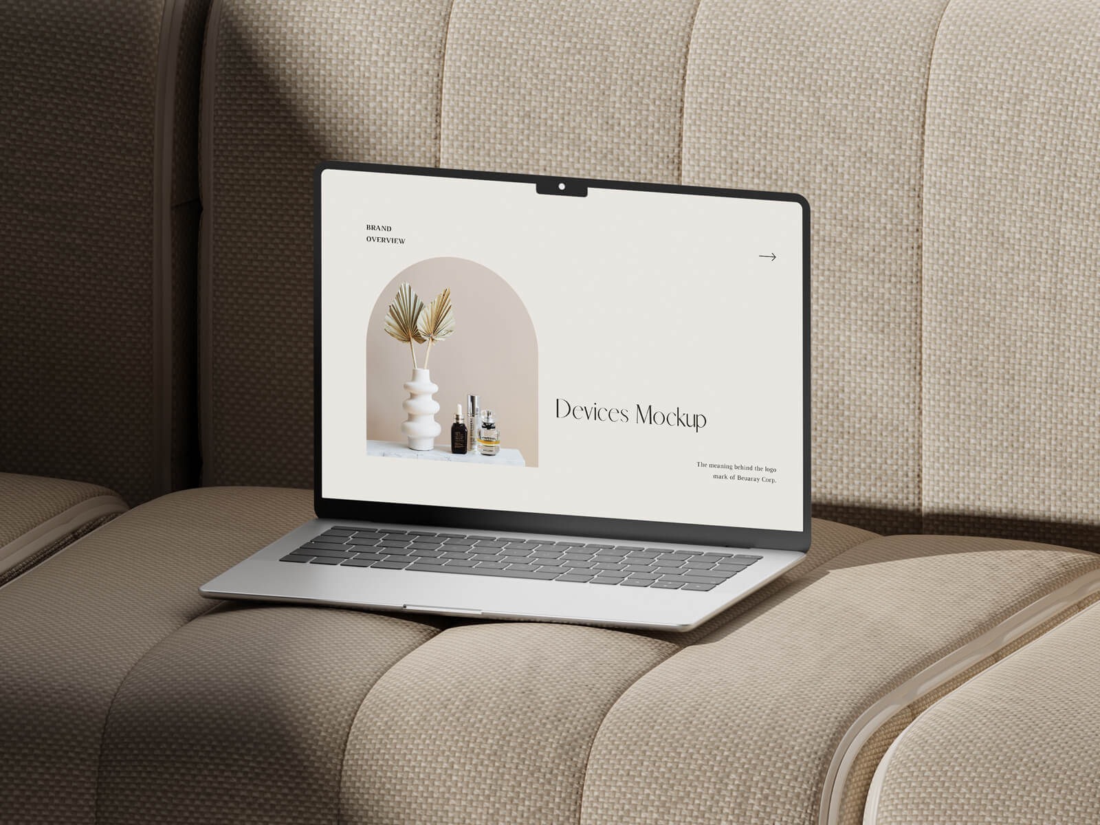 Free MacBook Pro On Sofa Mockup PSD