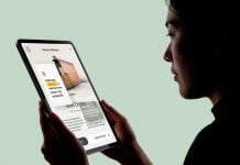 Free-Woman-in-Silhouette-Hand-Holding-iPad-Pro-Mockup-PSD