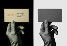 Free Gloved Hand Holding Business Card Mockup PSD