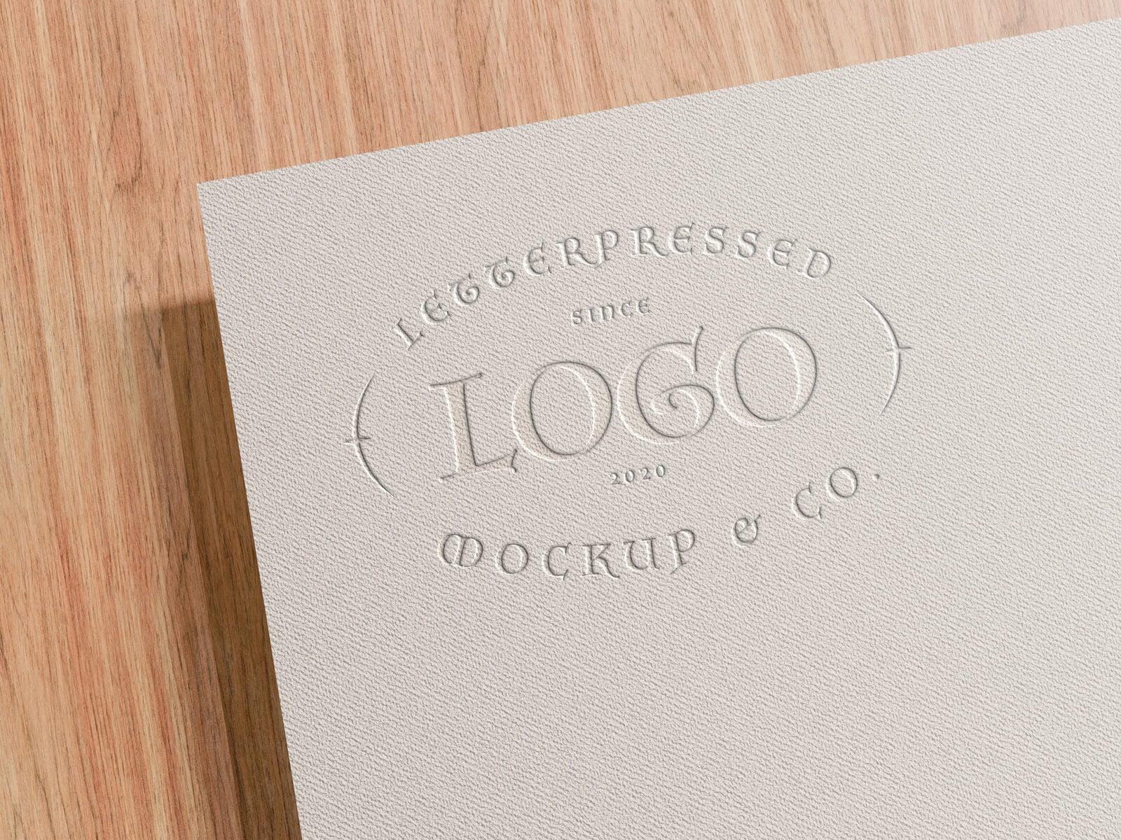 Free Letterpressed Paper Logo Mockup PSD